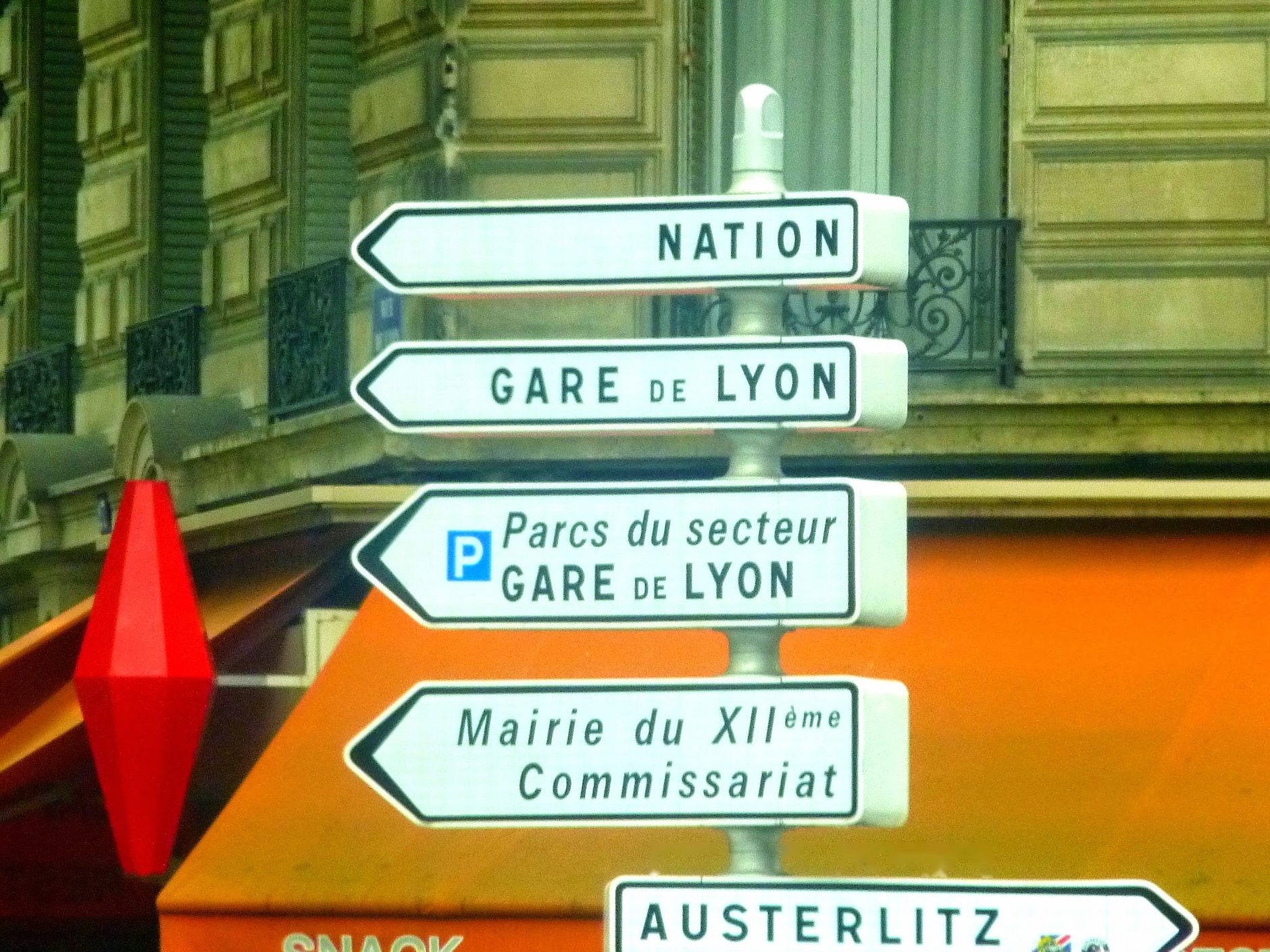 Paris street signs pointing every direction