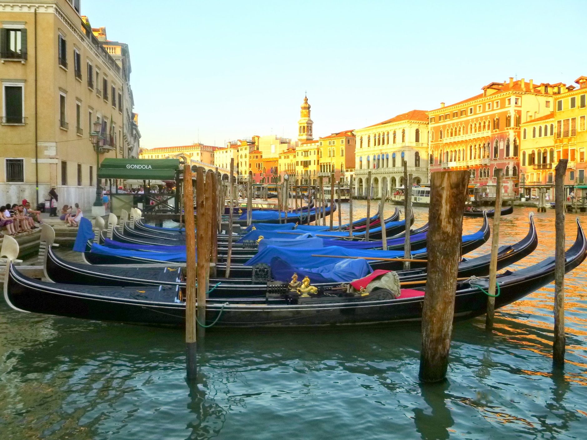 Gondolas moored side by side on a Venice canal